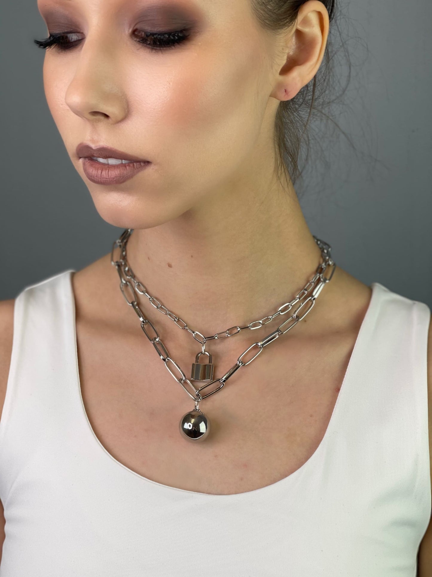Chain necklace with ball and lock pendants