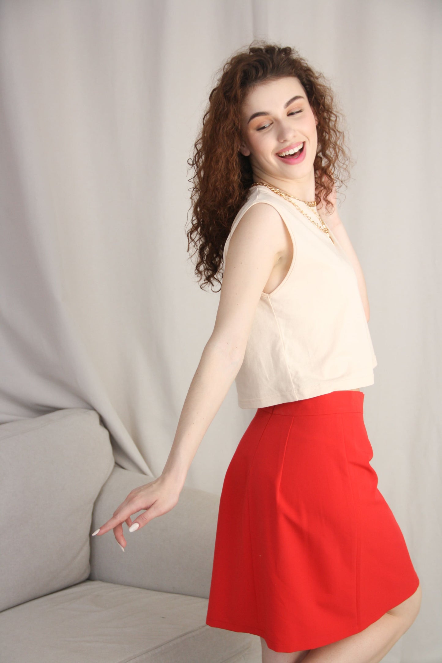 Beige Sleeveless T-Shirt With Red Mini Skirt