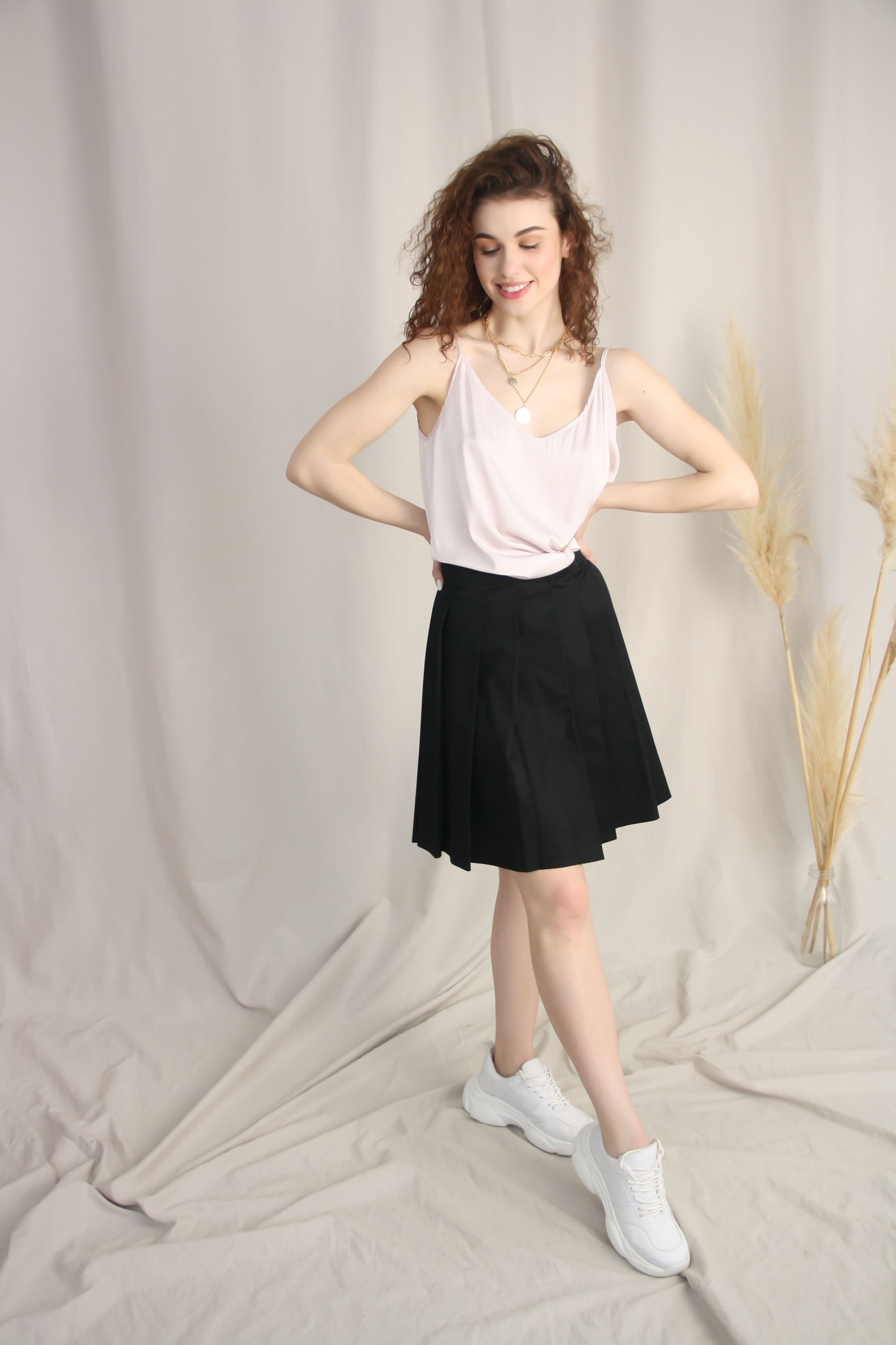 Silk V-Neck Camisole With Black Pleated Mini Skirt
