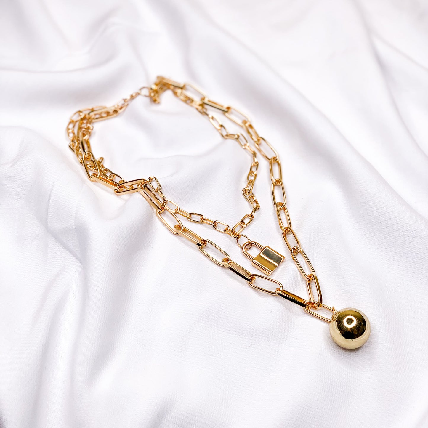 Chain necklace with ball and lock pendant