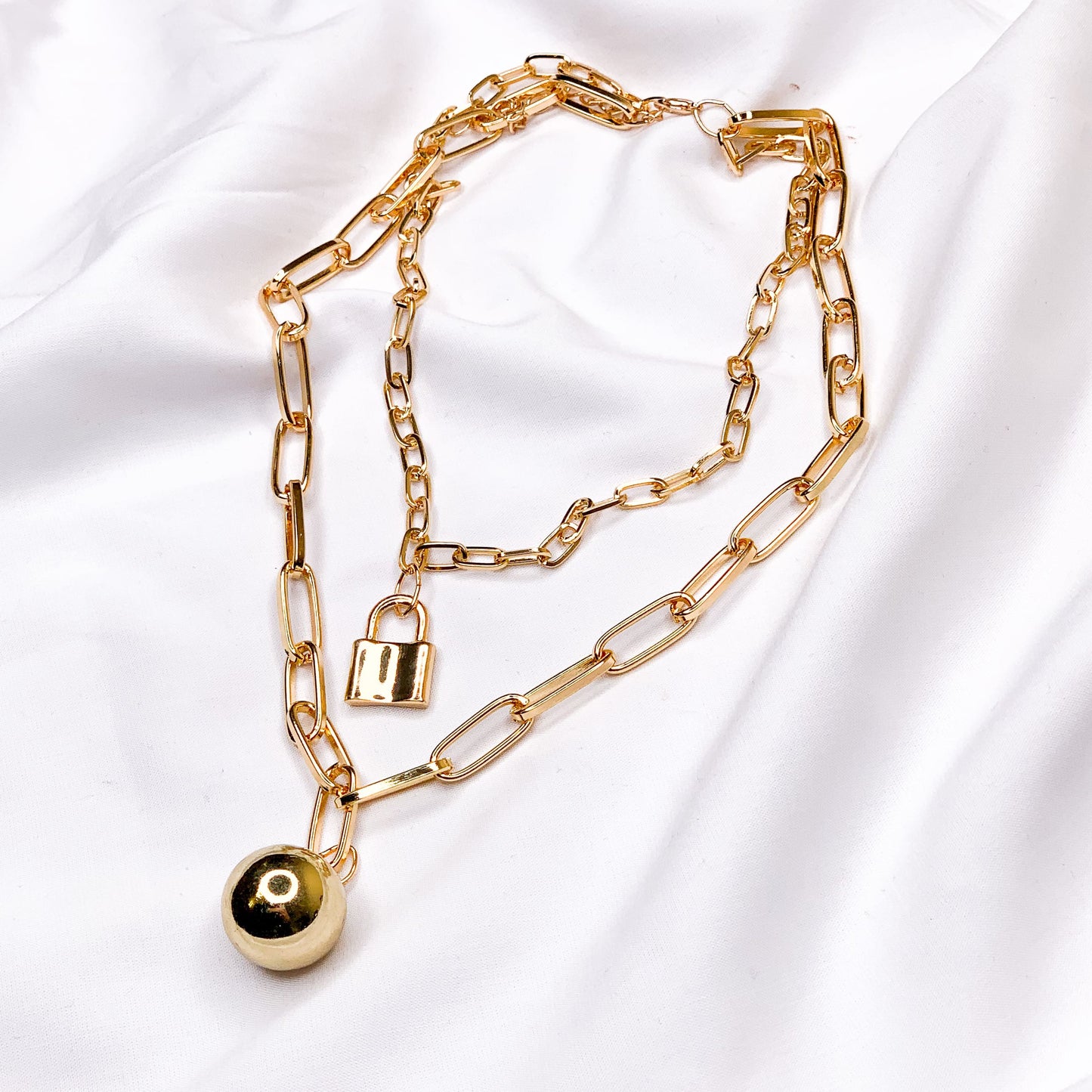 Chain necklace with ball and lock pendant